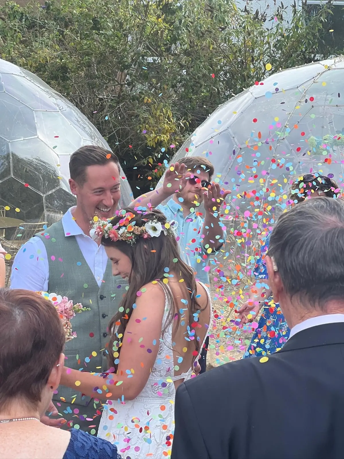 Wedding confetti moment by the domes