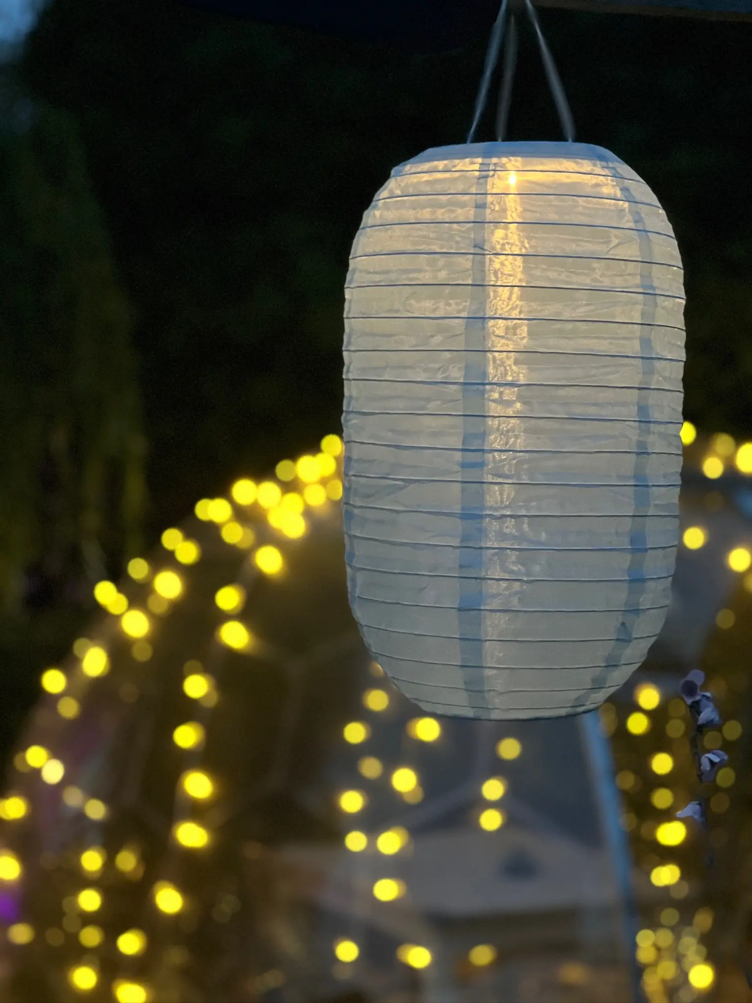 Lantern with fairy lights on dome at night