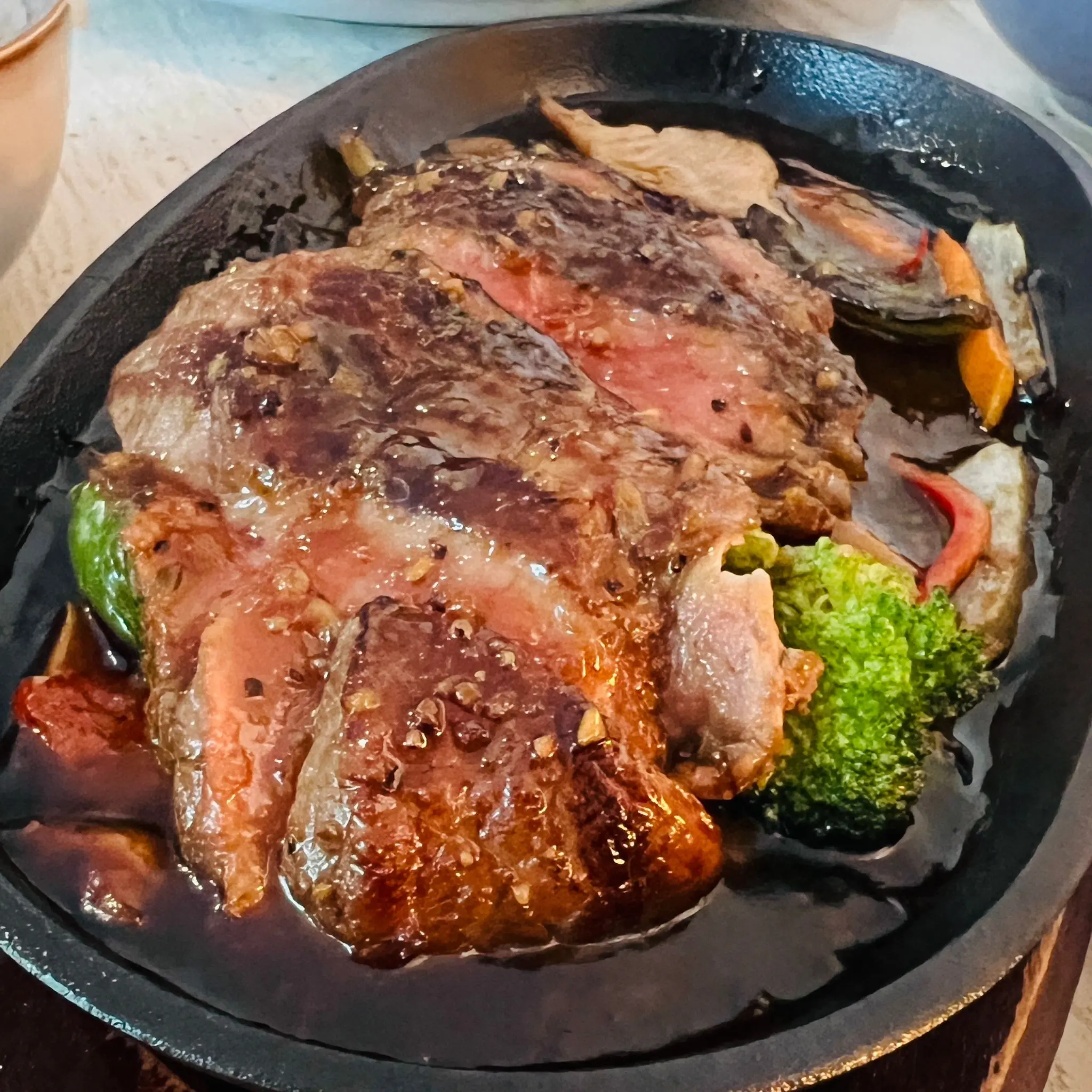 Sizzling steak on a hot plate
