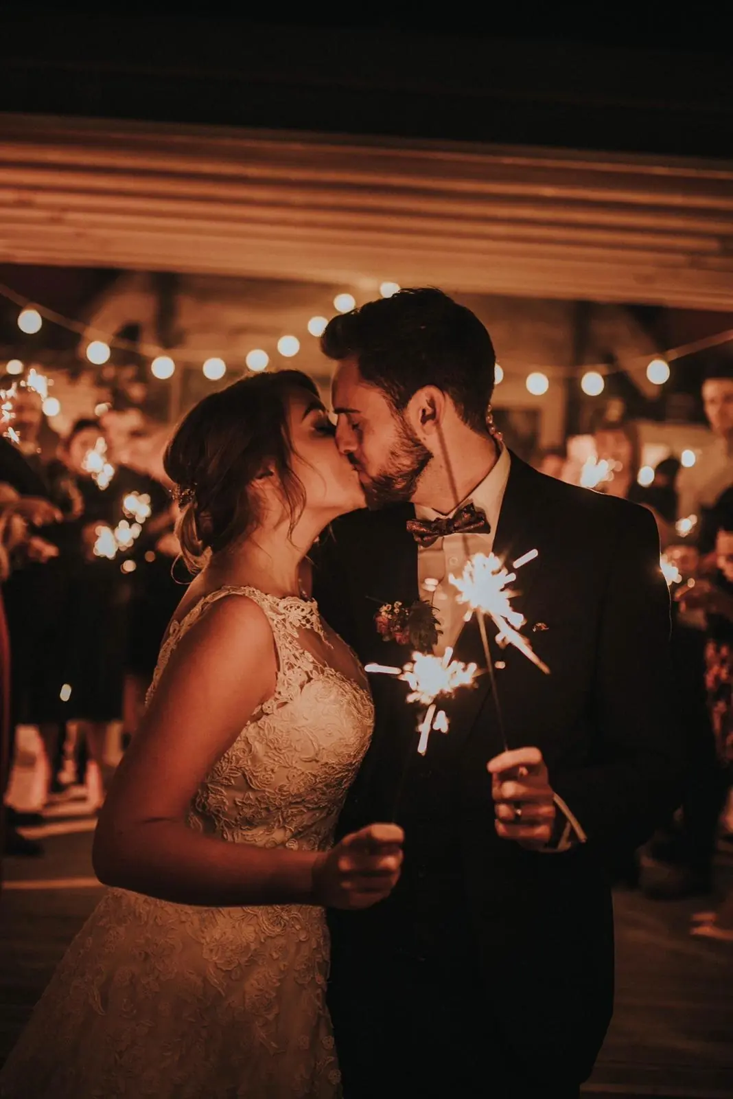 Wedding couple with sparklers at night