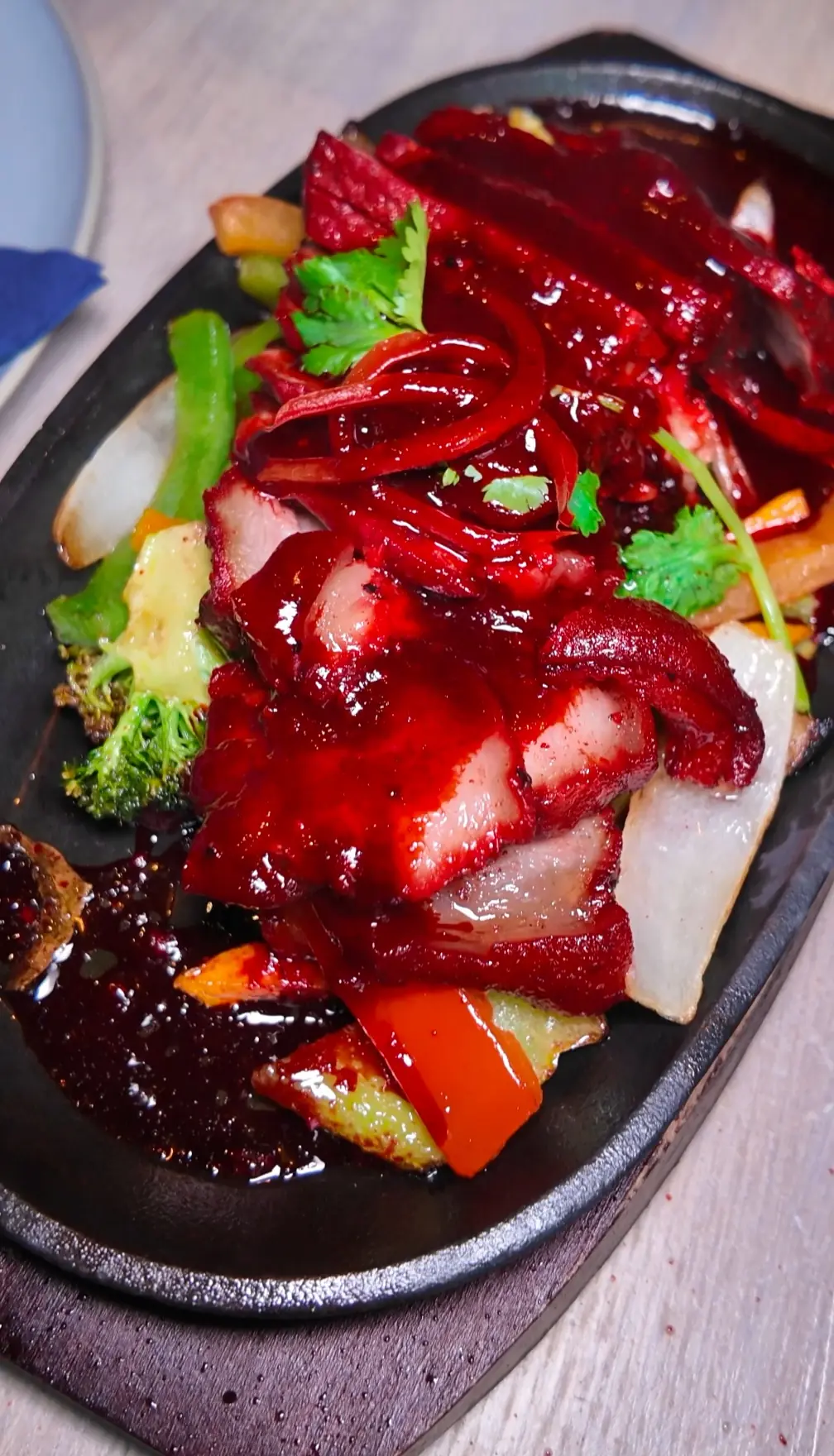 Thai Honey Red Pork on a sizzling plate