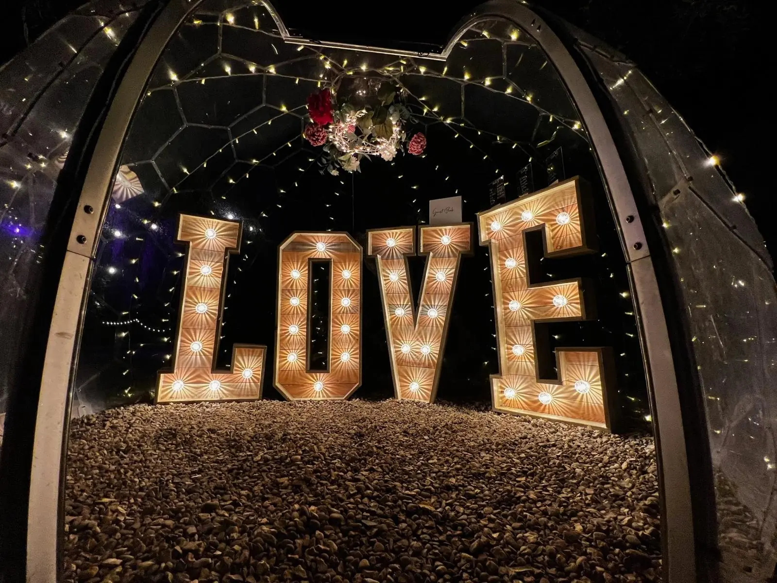 LOVE sign lit up inside a dome