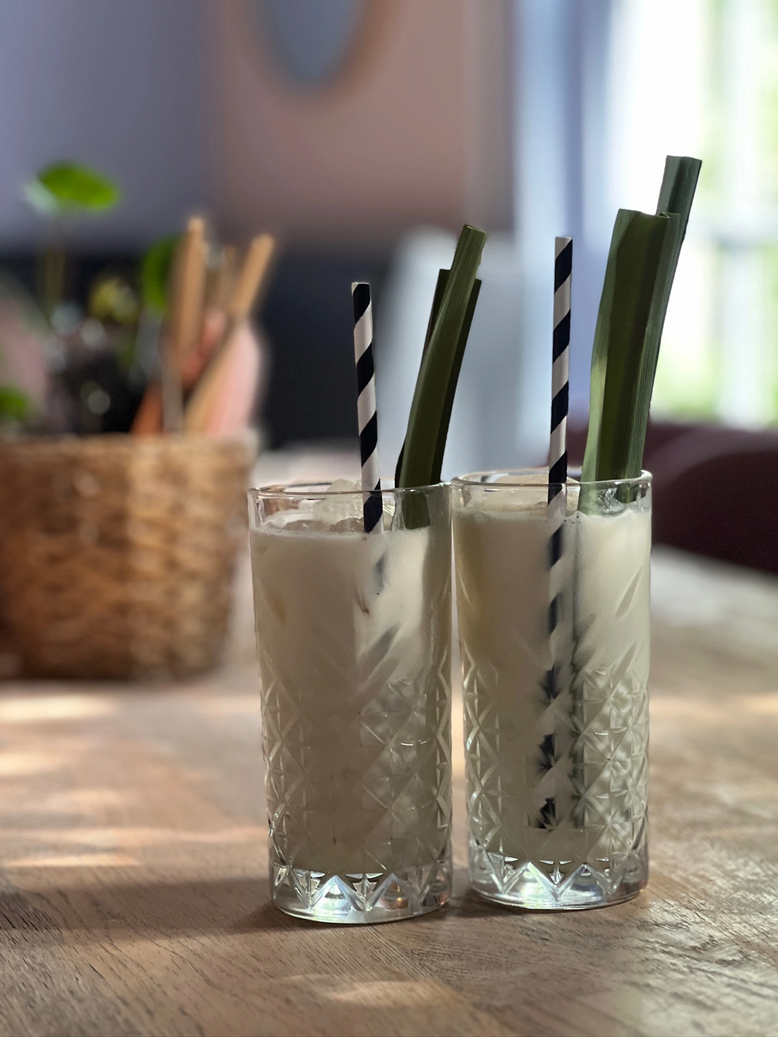Guests dining under the willow tree in sunshine